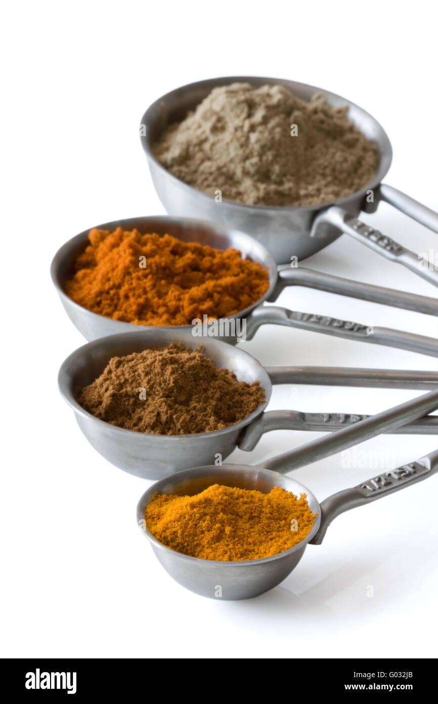 Messbecher mit Gewürzen - Measuring spoons with spices Stock Photo