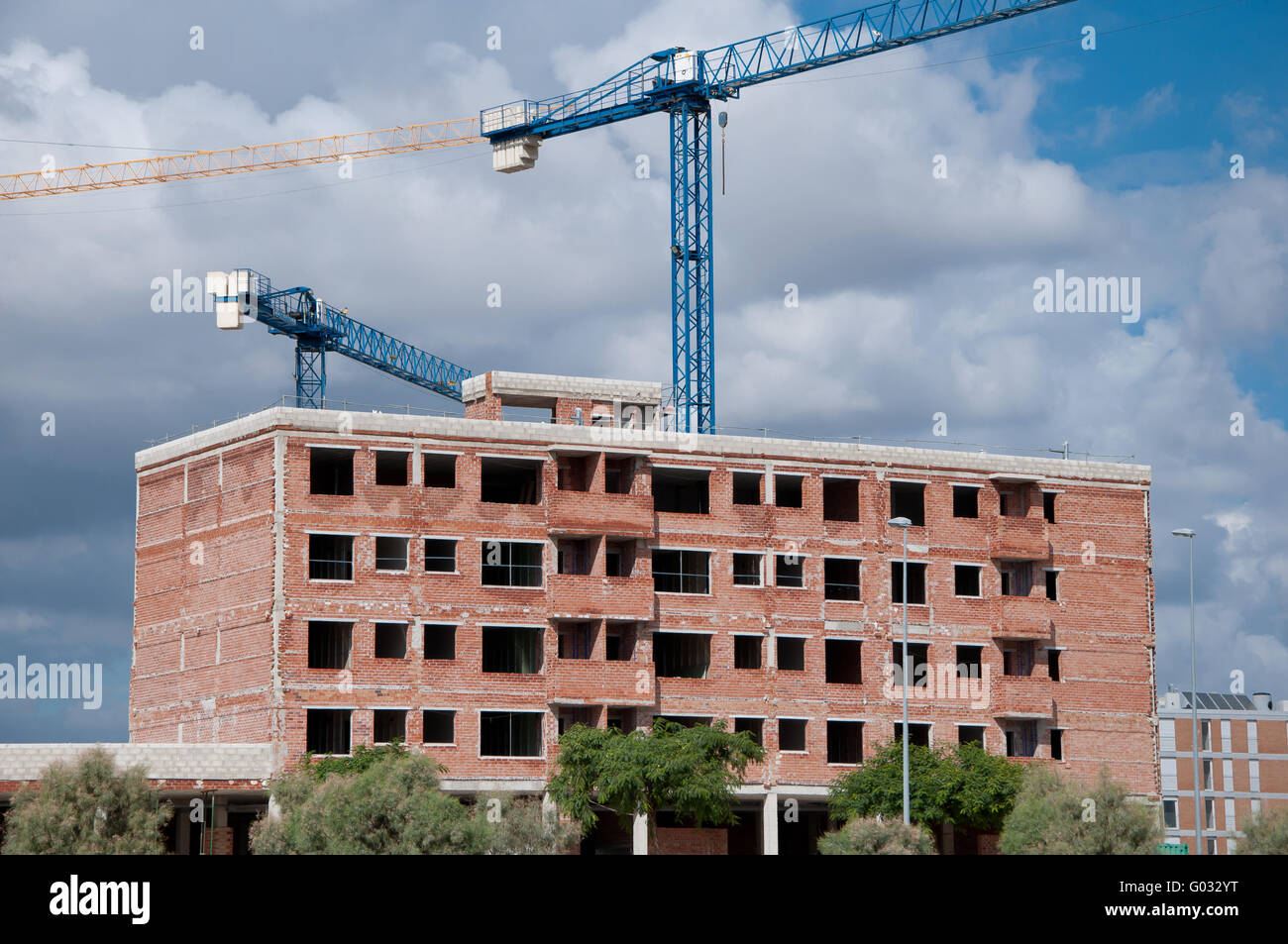 building under construction and cranes Stock Photo