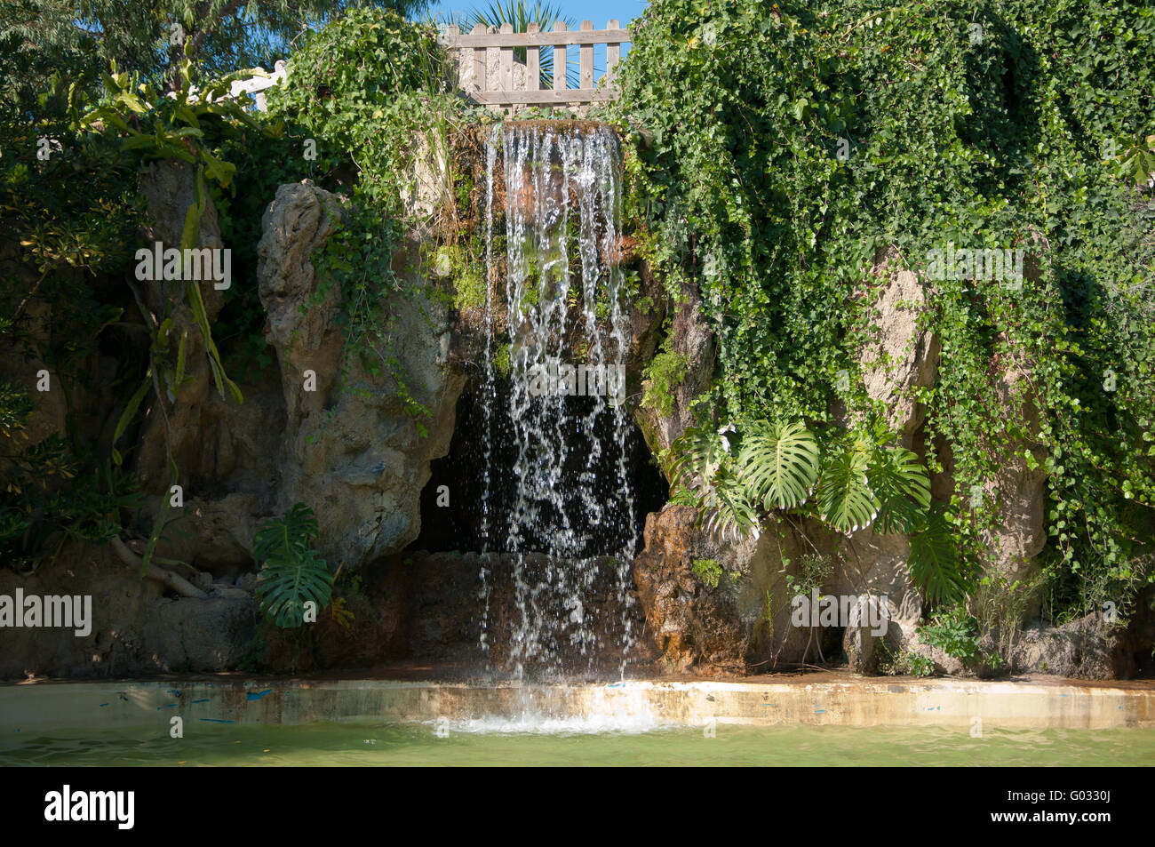 Waterfall and grotto in the Genovés park of Cadiz Stock Photo