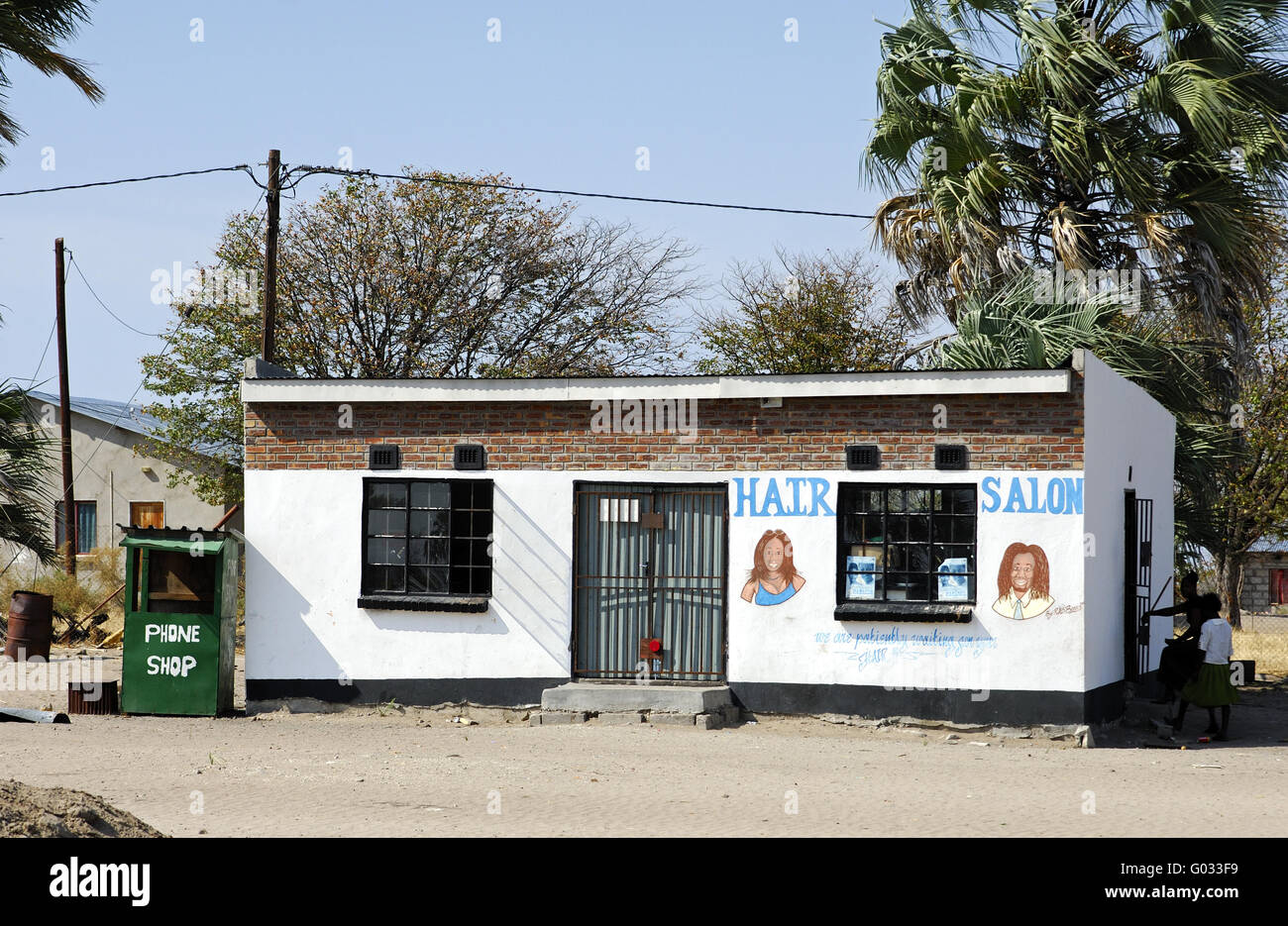 Hair salon and phone shop in an African village Stock Photo