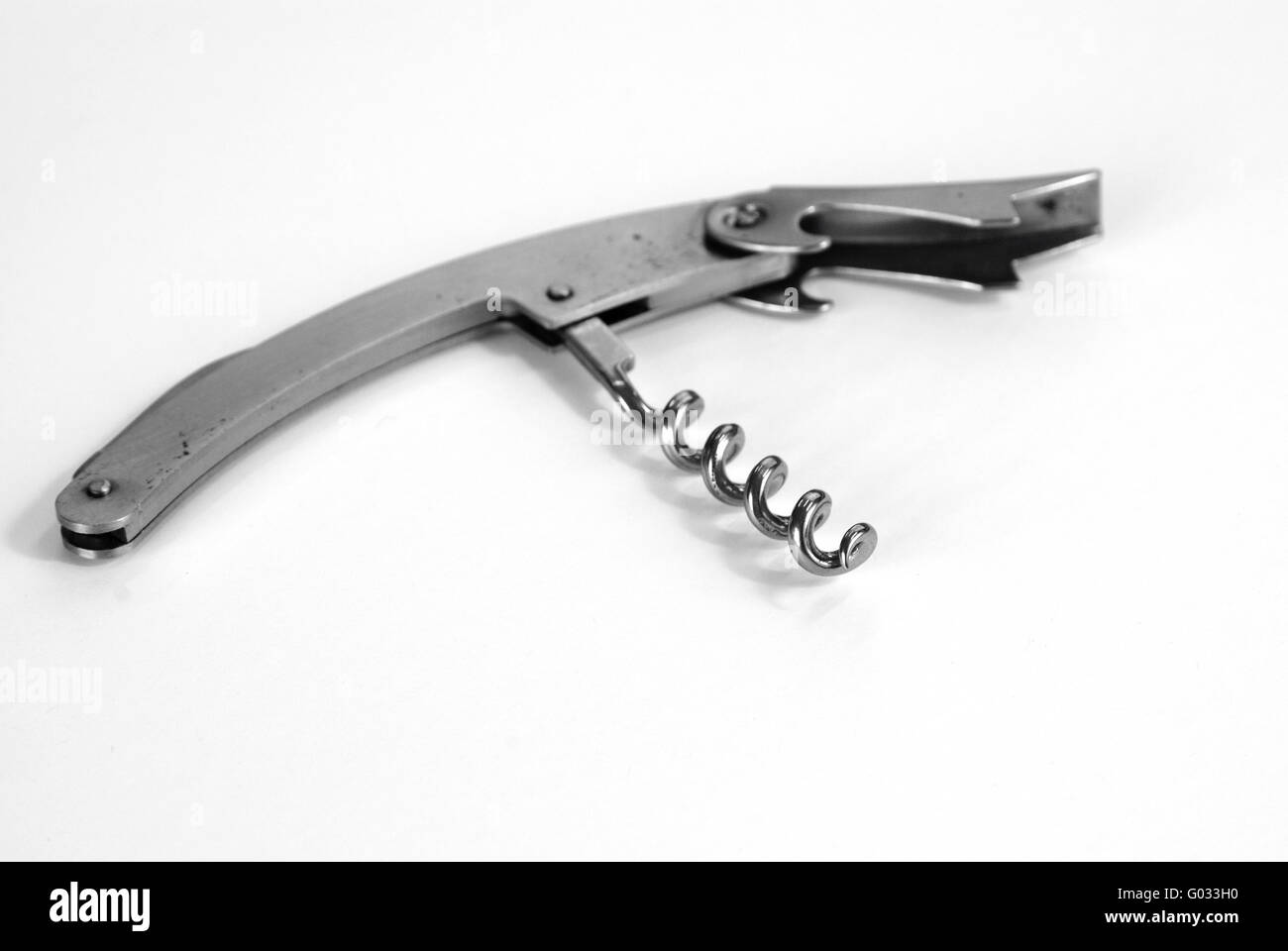 Corkscrew on white table Stock Photo Alamy