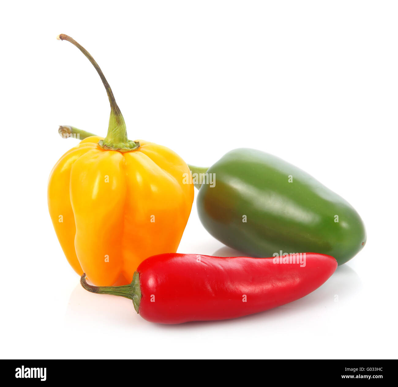 Three colored chili pepper vegetables isolated Stock Photo Alamy