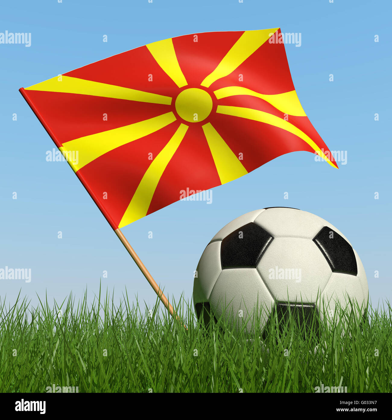 Soccer ball in the grass and the flag of Macedonia against the blue sky