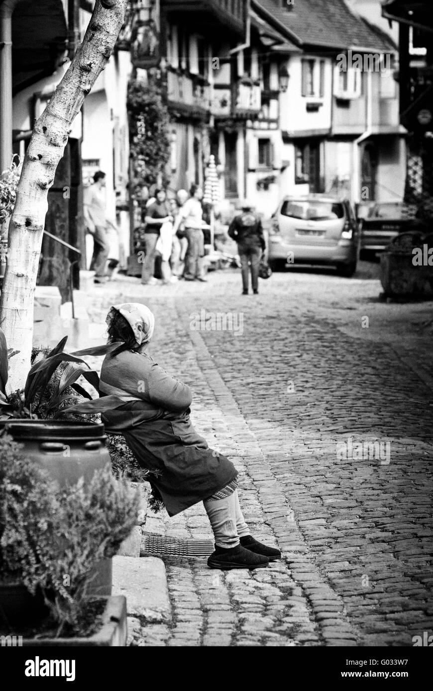 France Alsace Old woman sitting Stock Photo