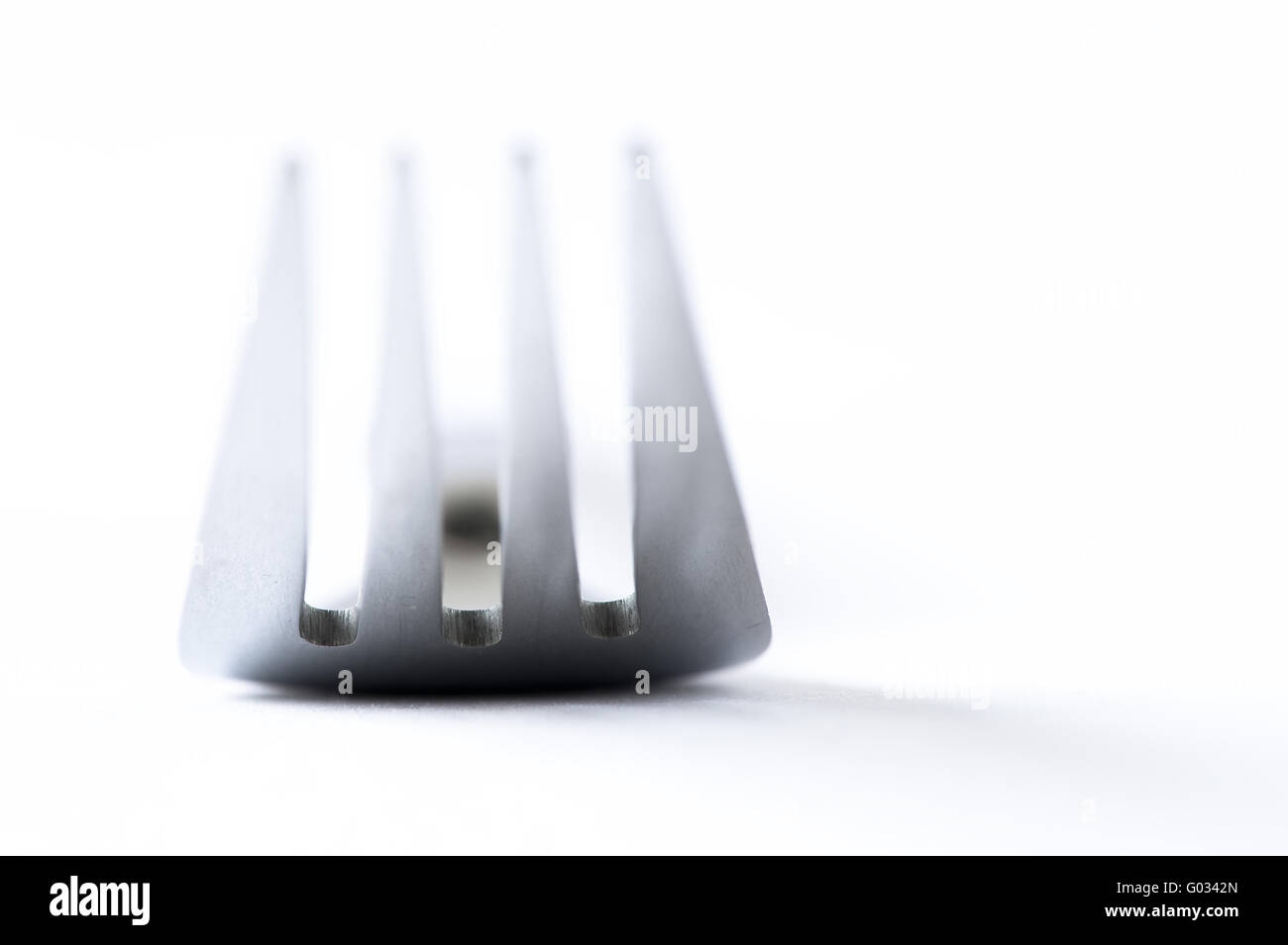 Close-up of a fork against a white background Stock Photo