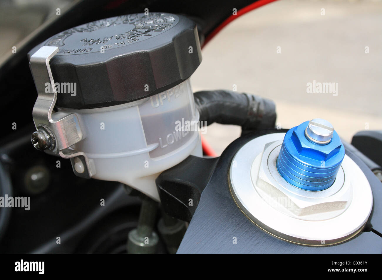 Motorcycle brake oil level and adjustable front suspension screw Stock