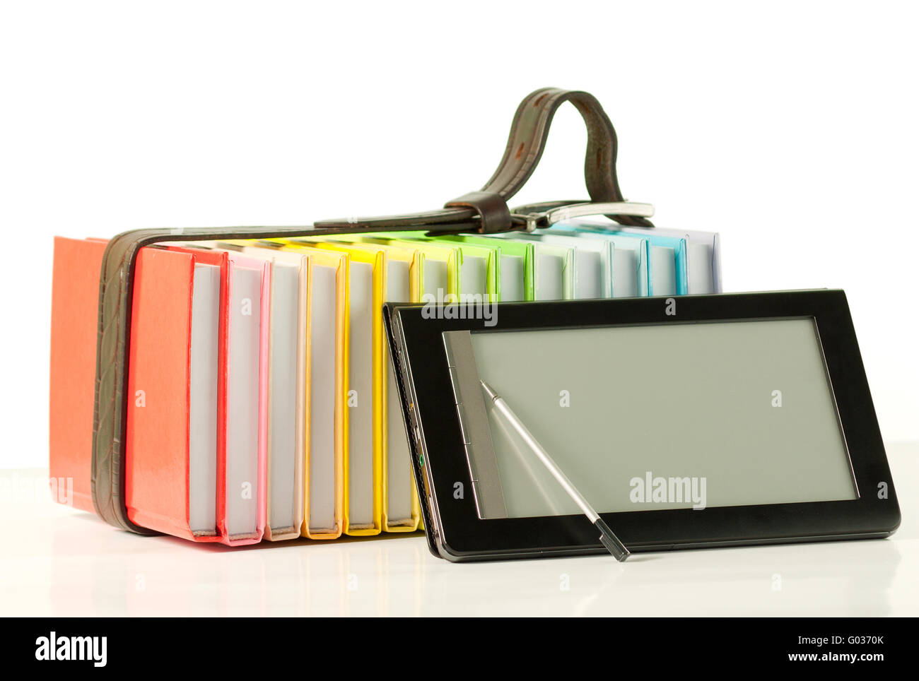 Stack of colorful books and electronic book reader Stock Photo Alamy