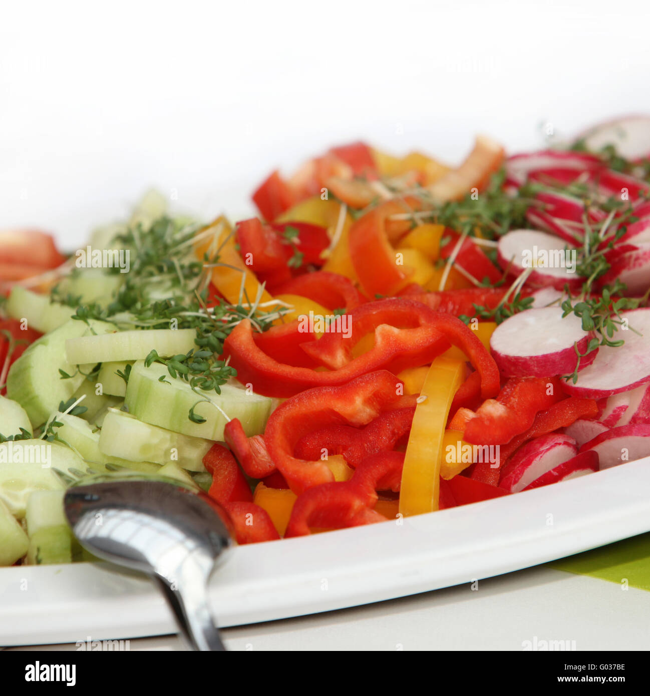 Delicious salad of cucumbers, peppers and radishes Stock Photo