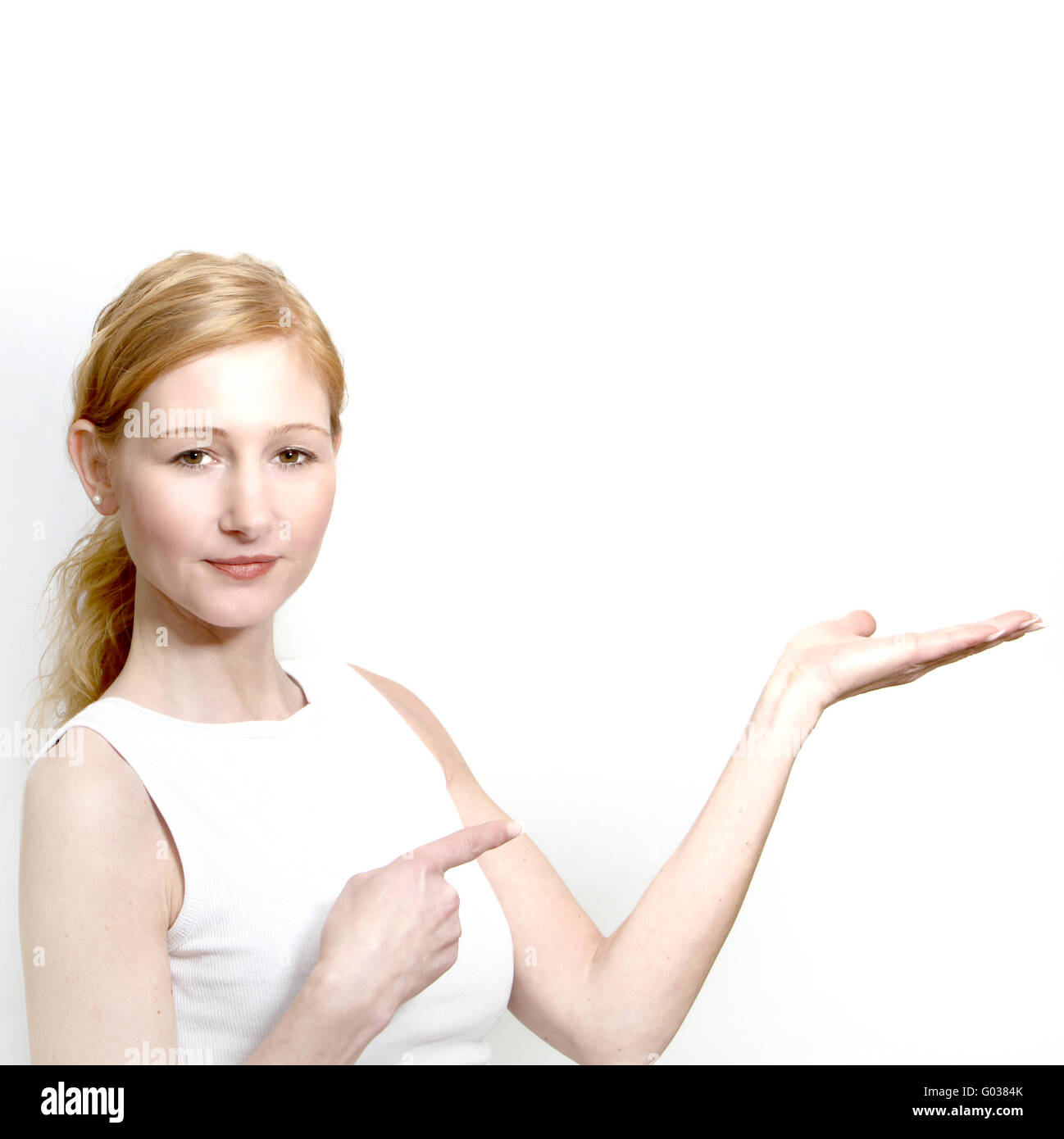 pretty cool woman presenting something - square Stock Photo