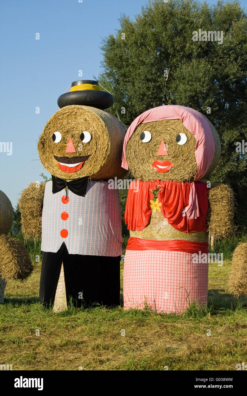 Two figures made out of straw bales Stock Photo