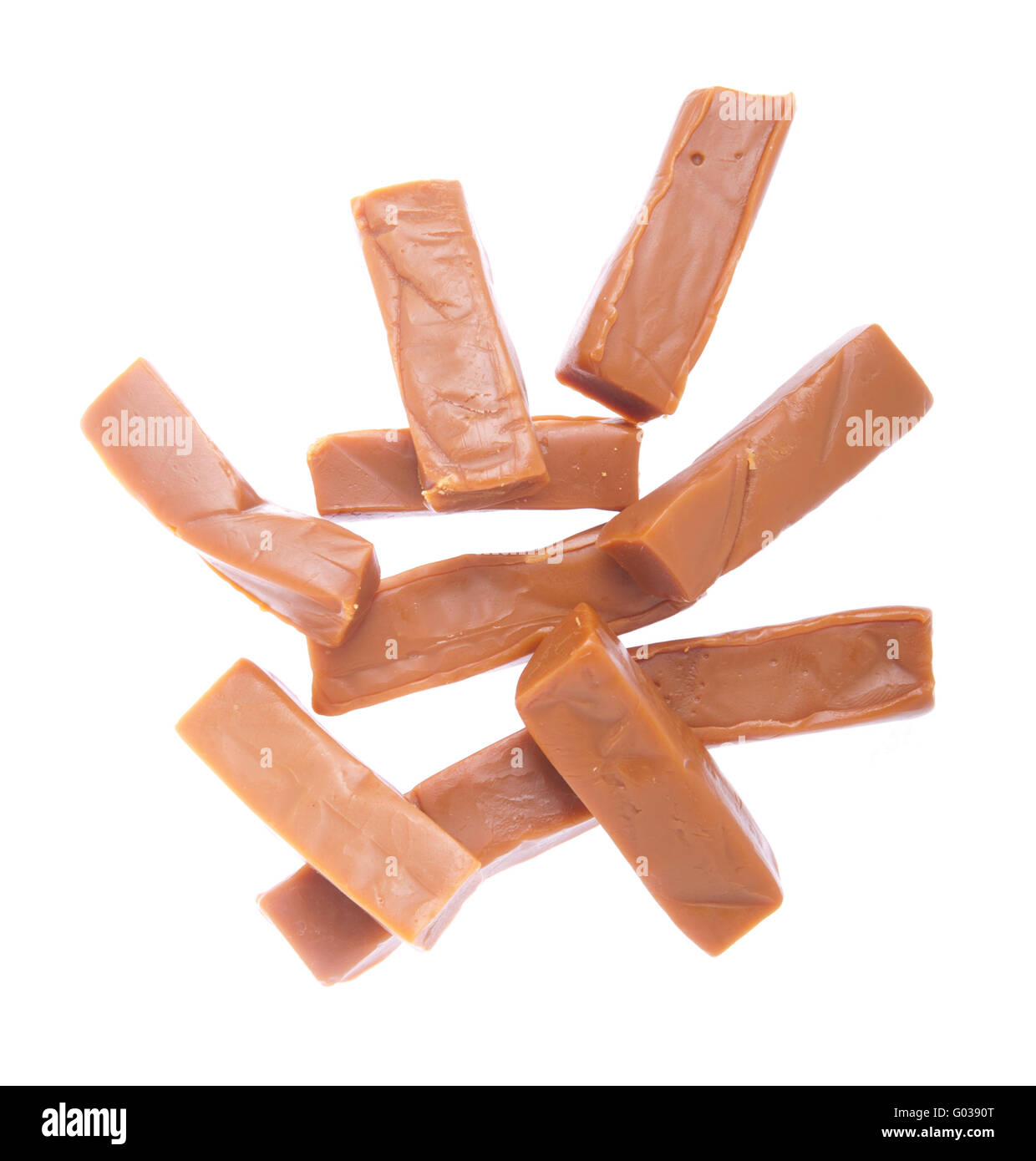 bunch of caramels pieces isolated on white background Stock Photo Alamy