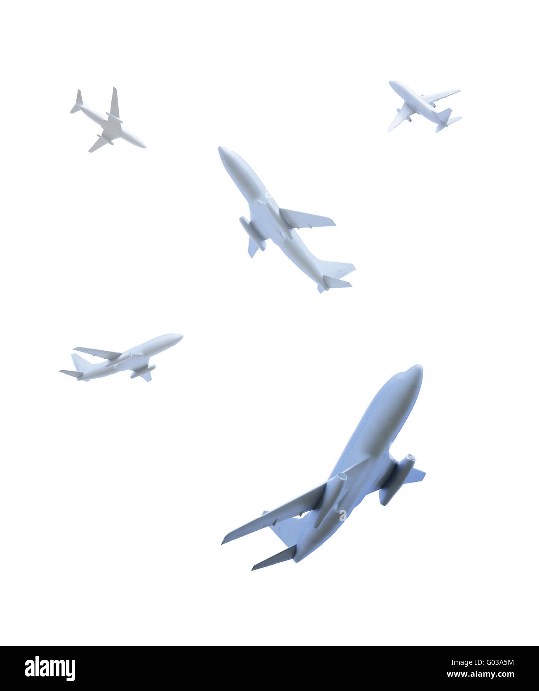 Five airplanes flying in different directions over the viewer Stock Photo