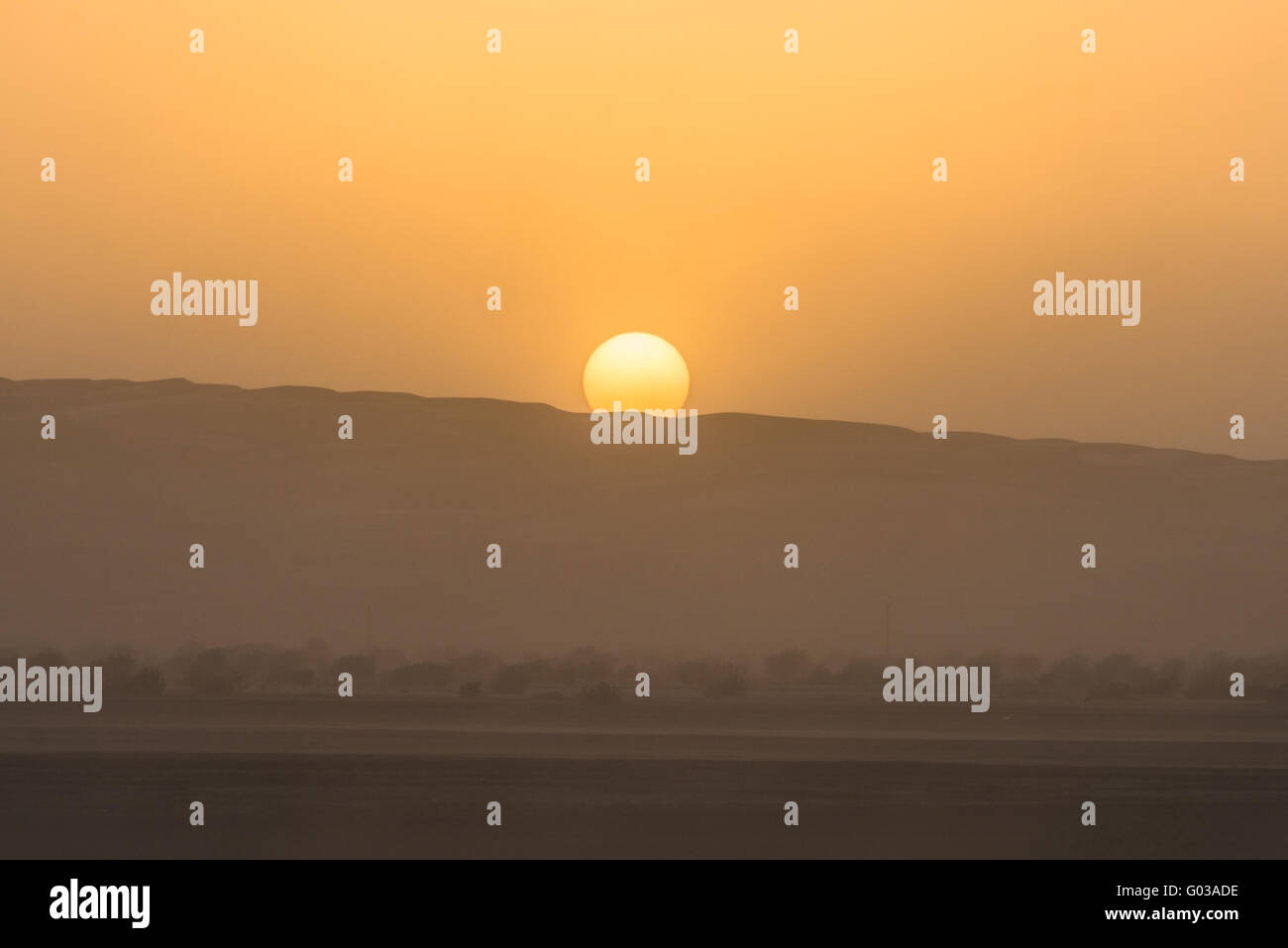 Sunset during a desert sand storm, Oman. Stock Photo