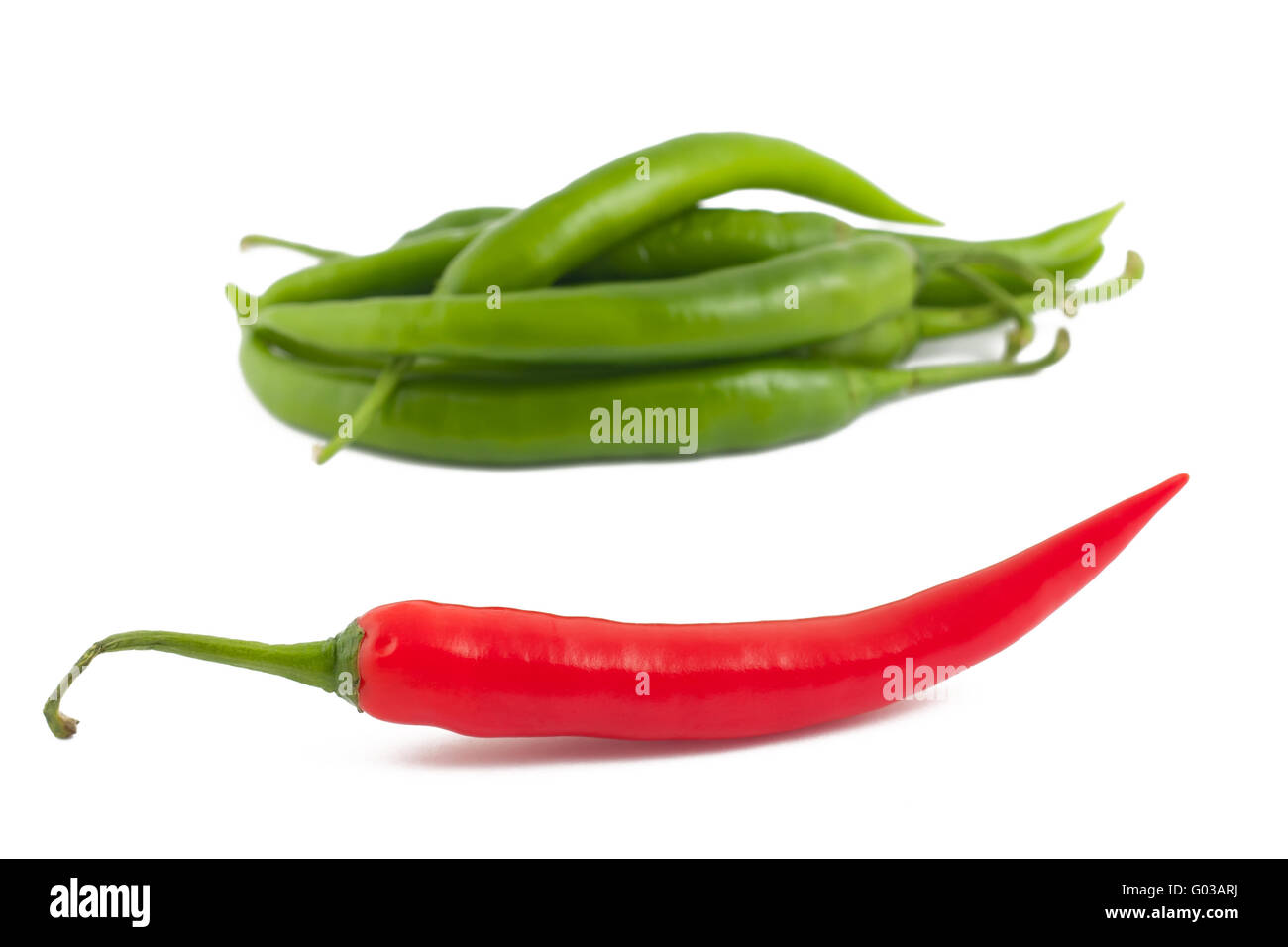 Red chili peppers on green chili peppers backgroun Stock Photo - Alamy