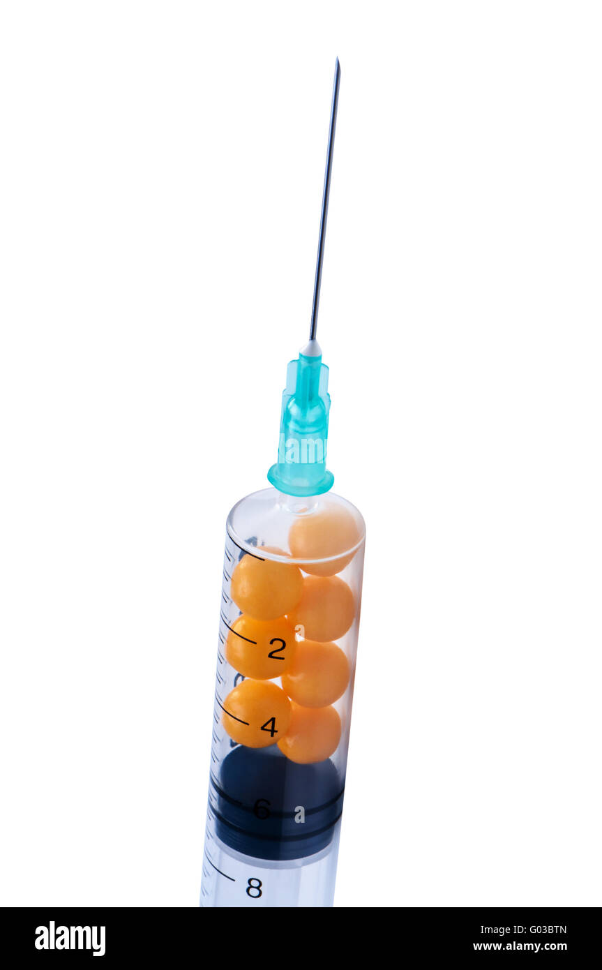 Syringe with pills isolate on white background. Stock Photo