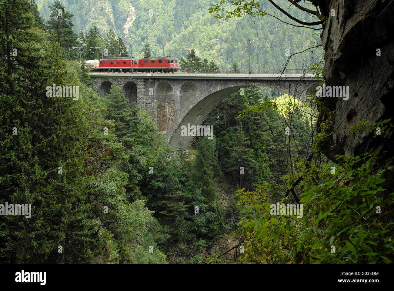 Railway traversing a viaduct in Uri, Switzerland Stock Photo