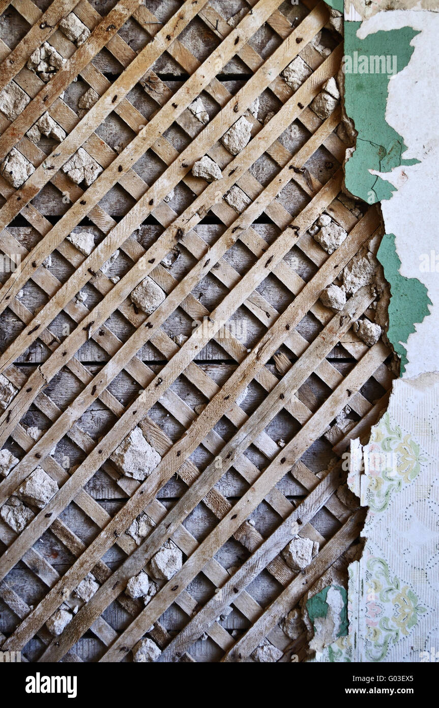 Grunge lath and plaster background on old destroyed wall Stock Photo
