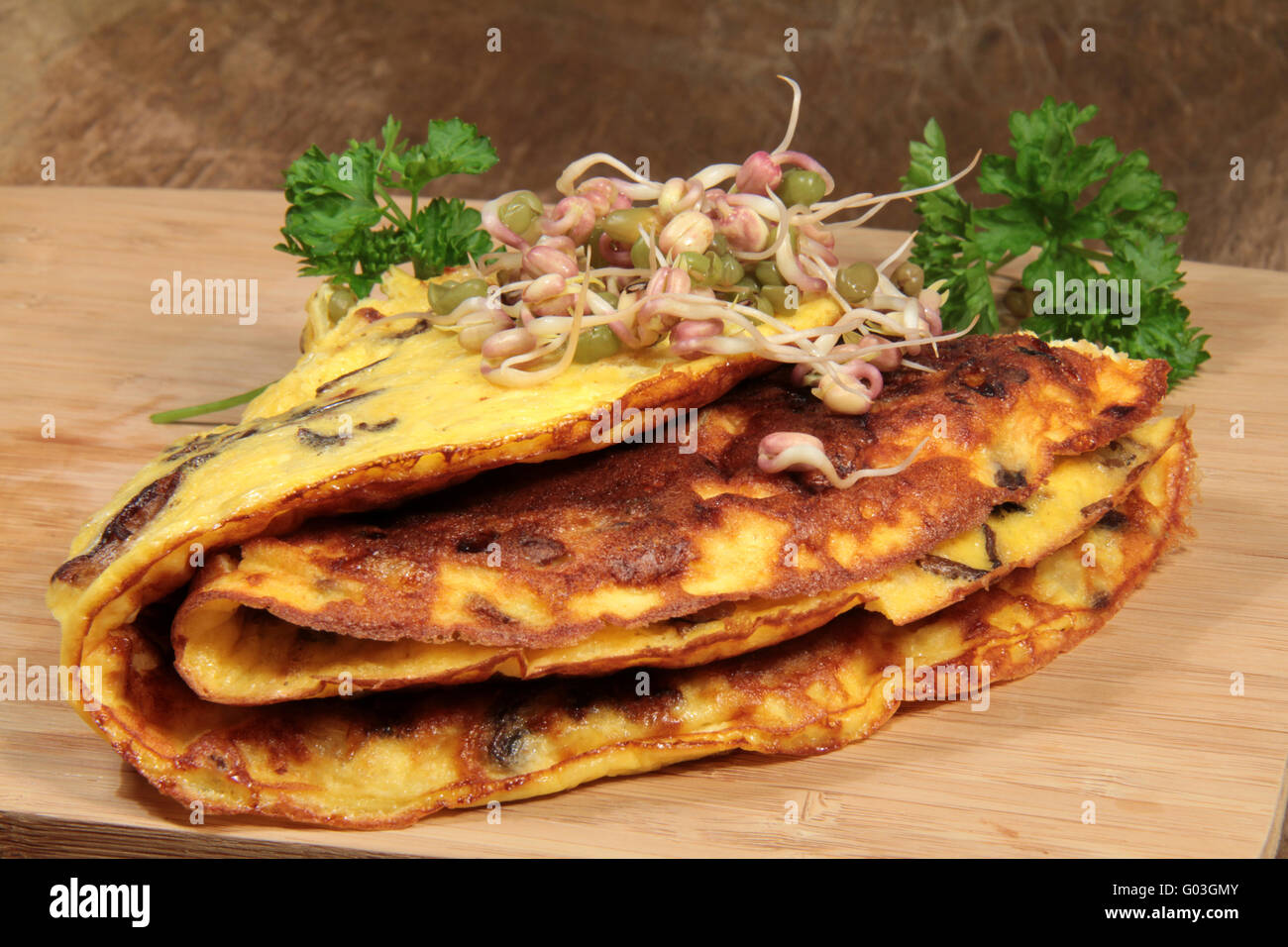 Omelette with mushrooms and mung bean sprouts Stock Photo Alamy