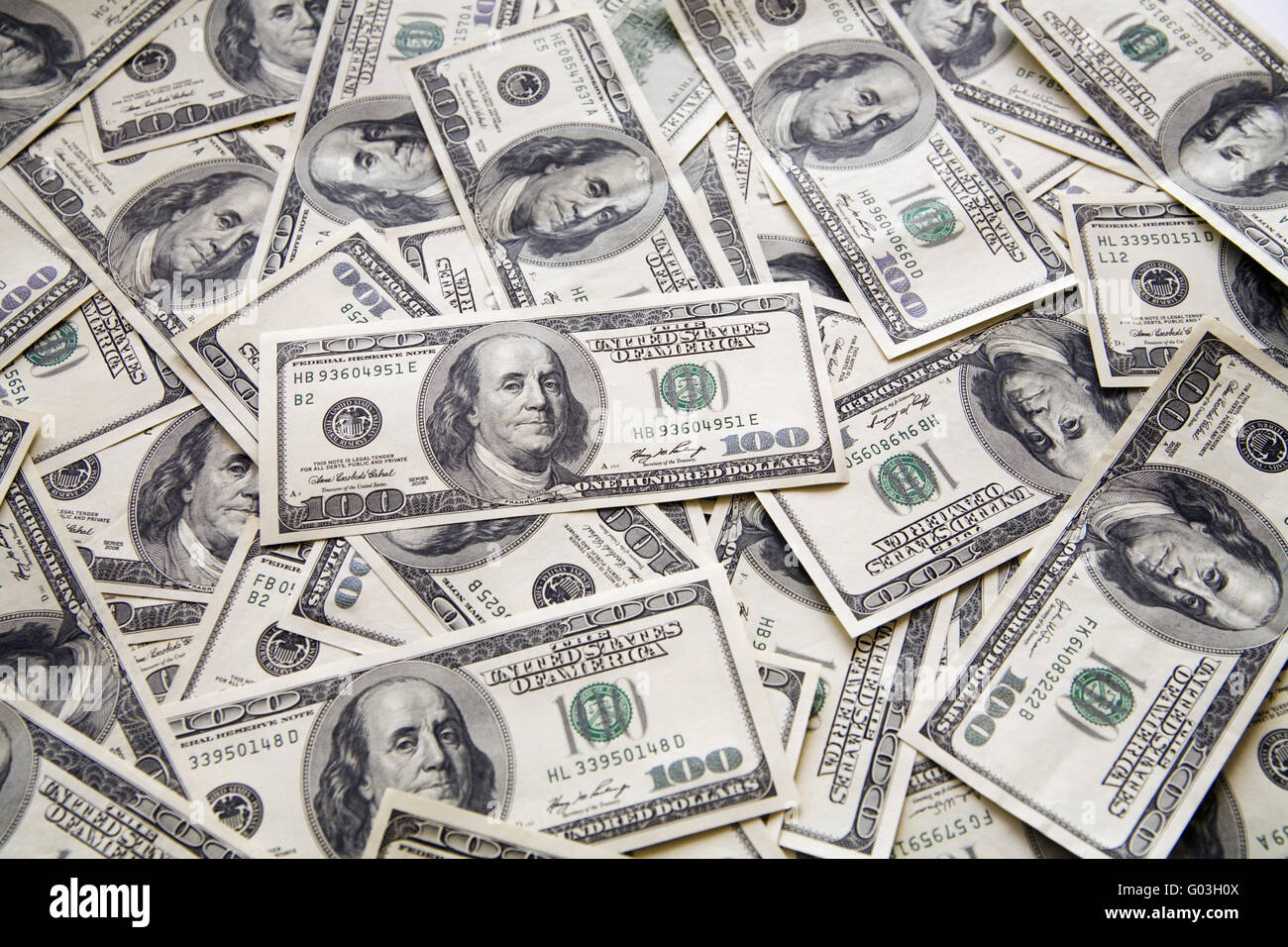 background from chaotically lyings one hundred greenbacks Stock Photo