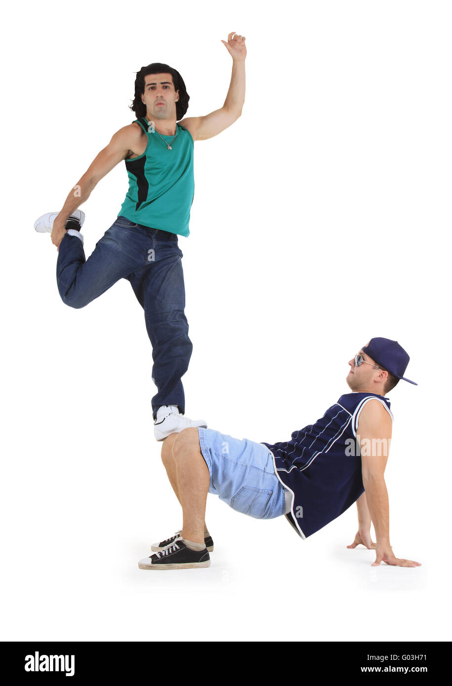 young male dancers performing a bboying stunt Stock Photo