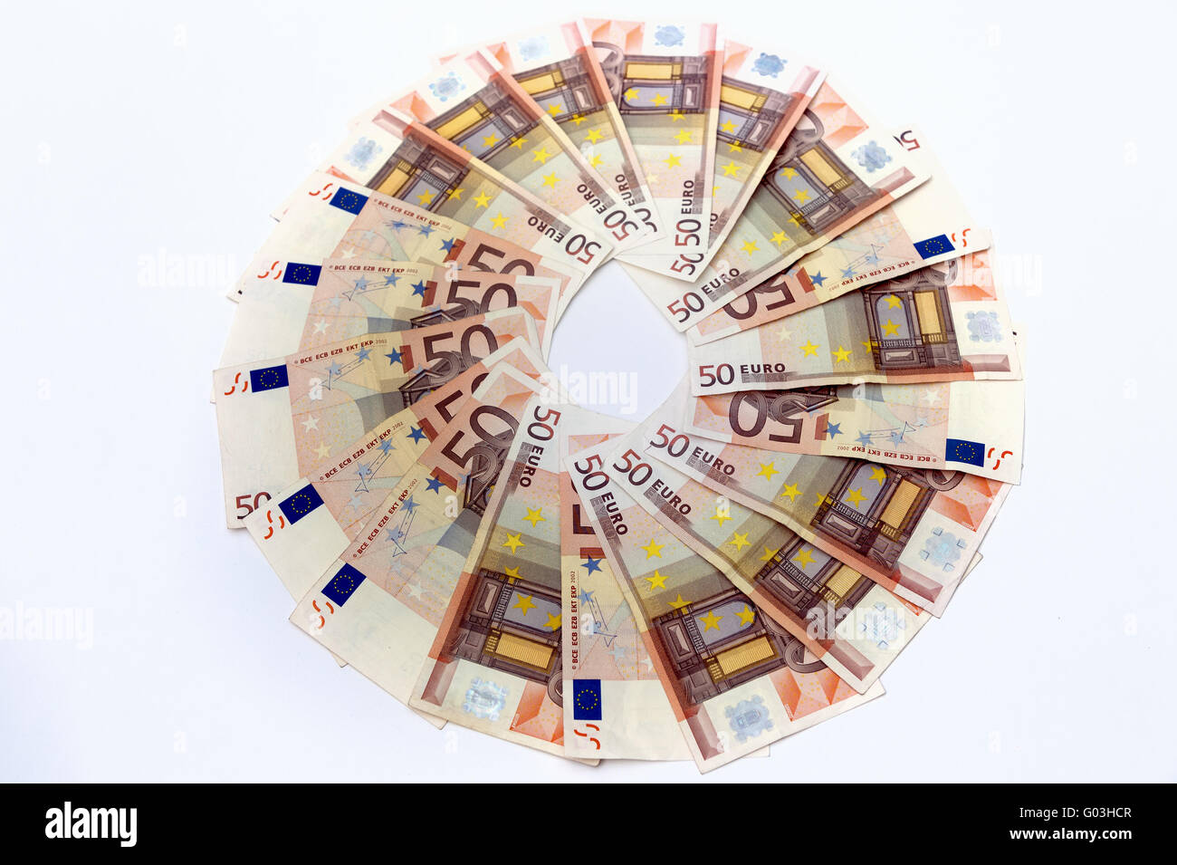 a circle of 50-euro notes on a white background Li Stock Photo