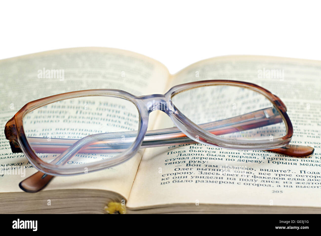 reading glasses lying on the book isolated on whit Stock Photo Alamy