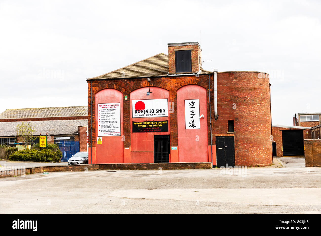 Karate school building signs shop sign name Konjaku Shin exterior logo