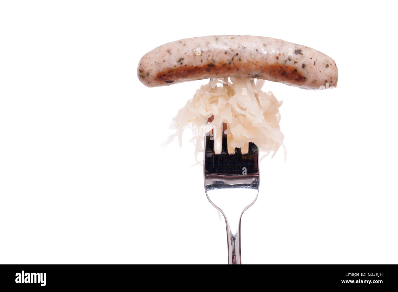 Nuremberger bratwurst with sourcrout on a fork Stock Photo