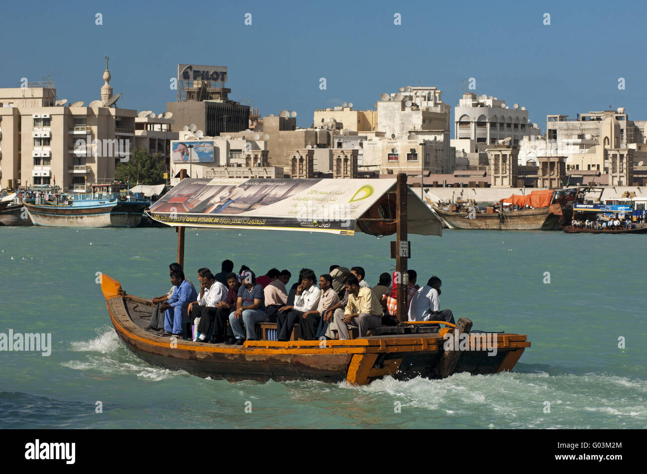 Abra water taxi  crisscrossing the Dubai Creek Stock Photo