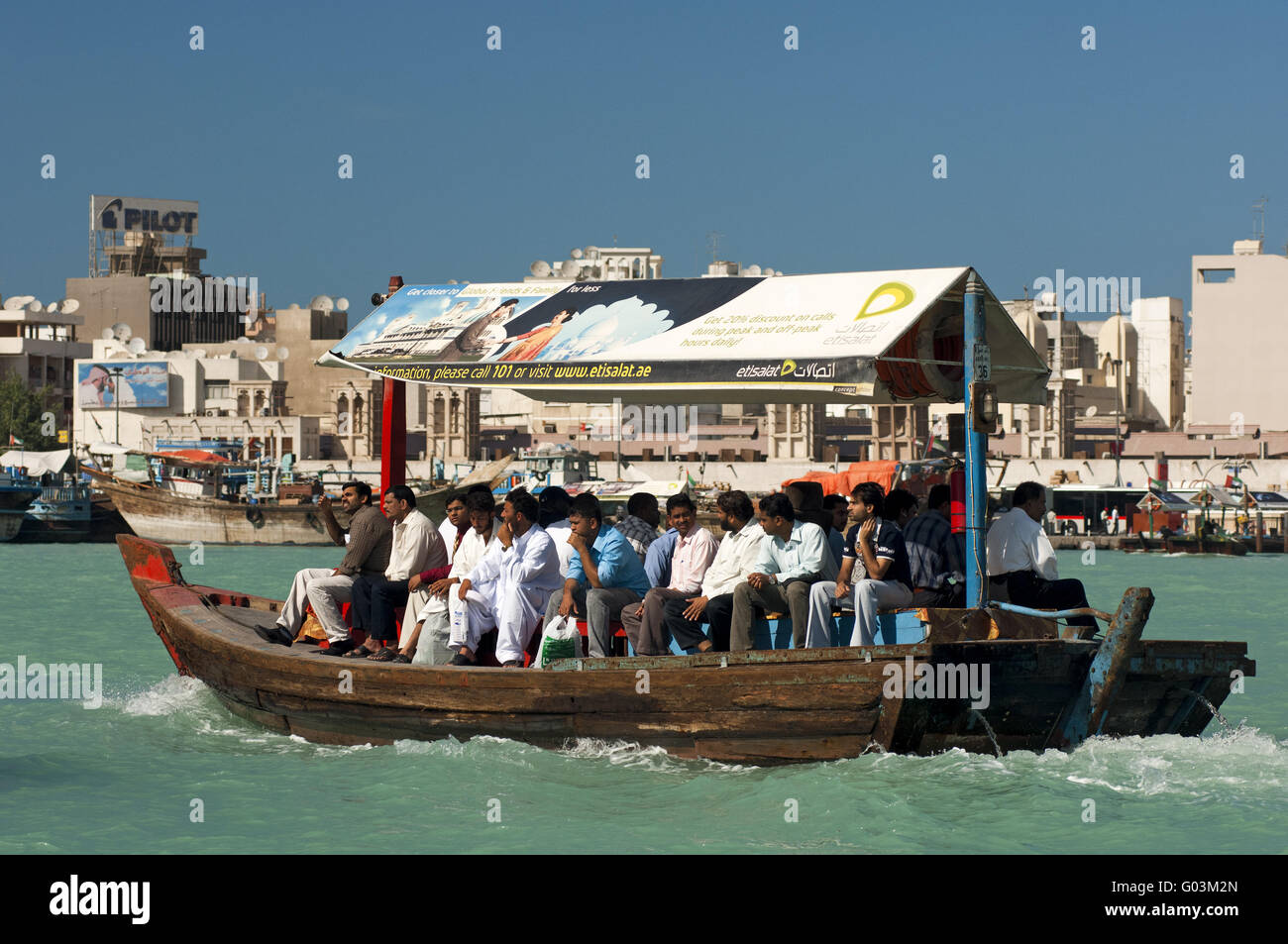 Abra water taxi  crisscrossing the Dubai Creek Stock Photo