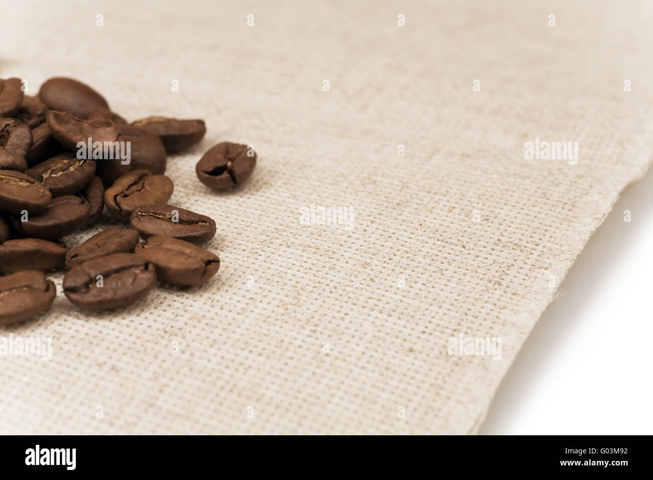 roasted coffee beans on a yellow paper napkin Stock Photo