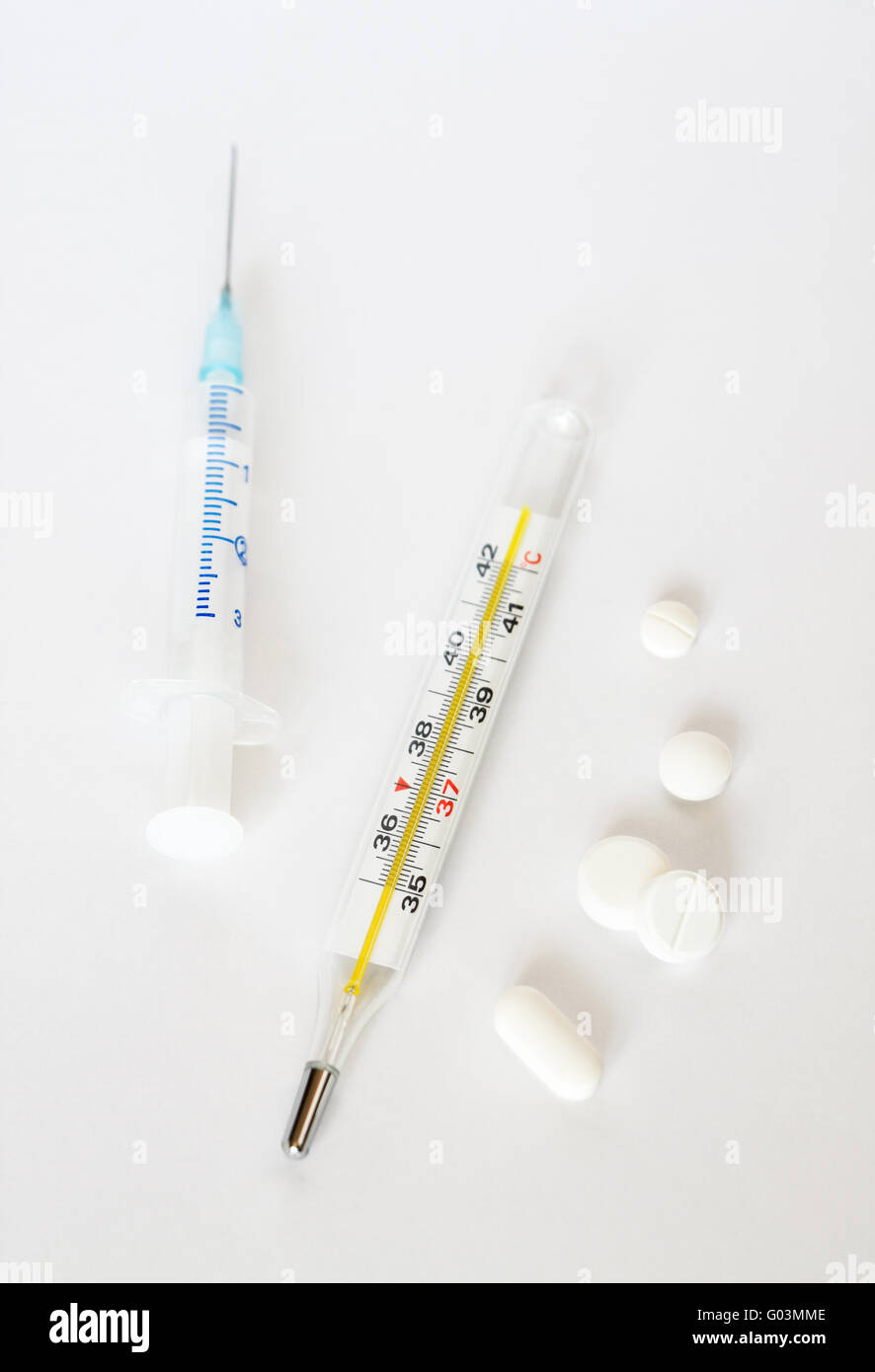 https://c8.alamy.com/comp/G03MME/clinical-thermometer-medical-syringe-and-white-pi-G03MME.jpg