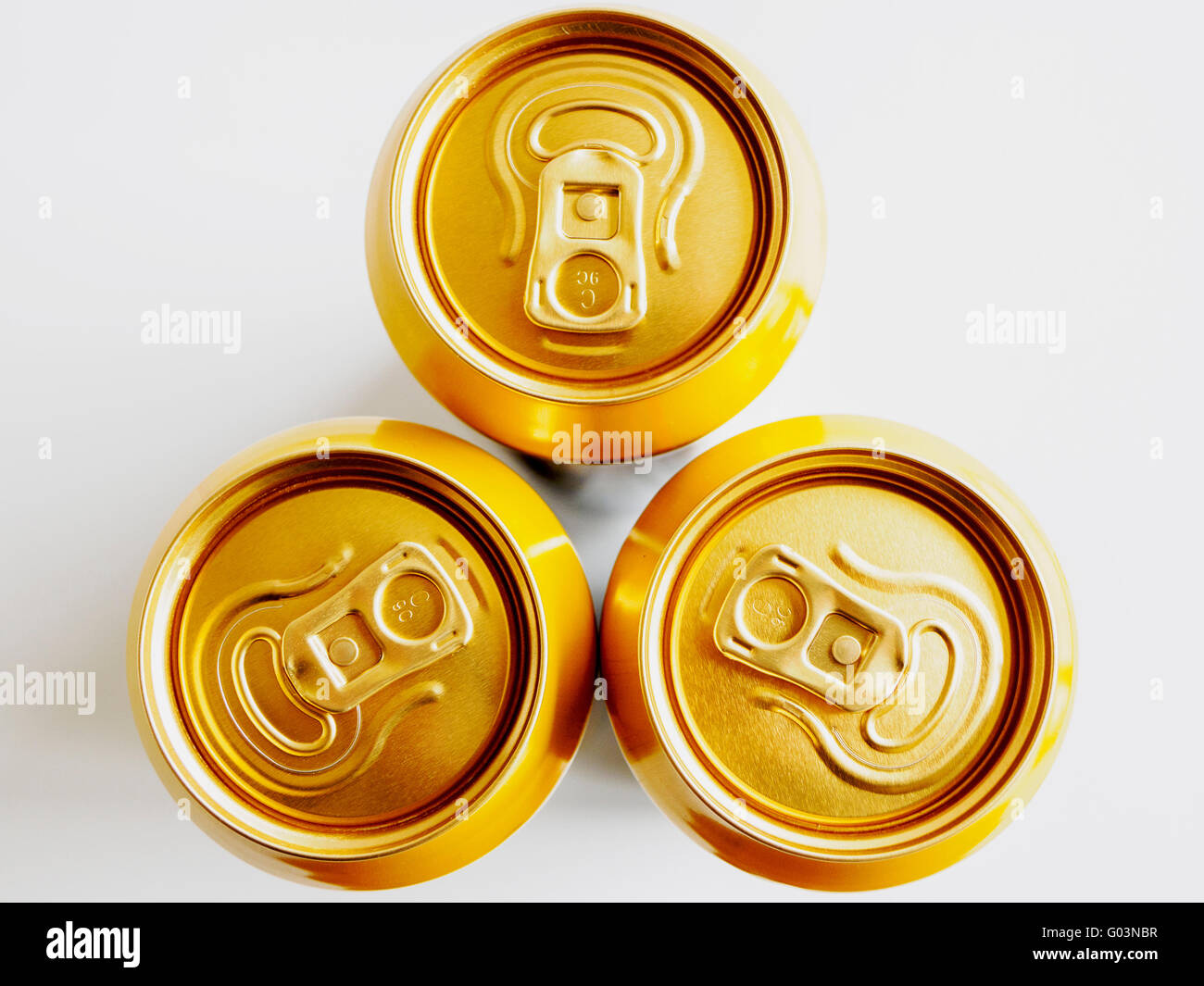 Three ring pull cans seen from above showing the staytab opening