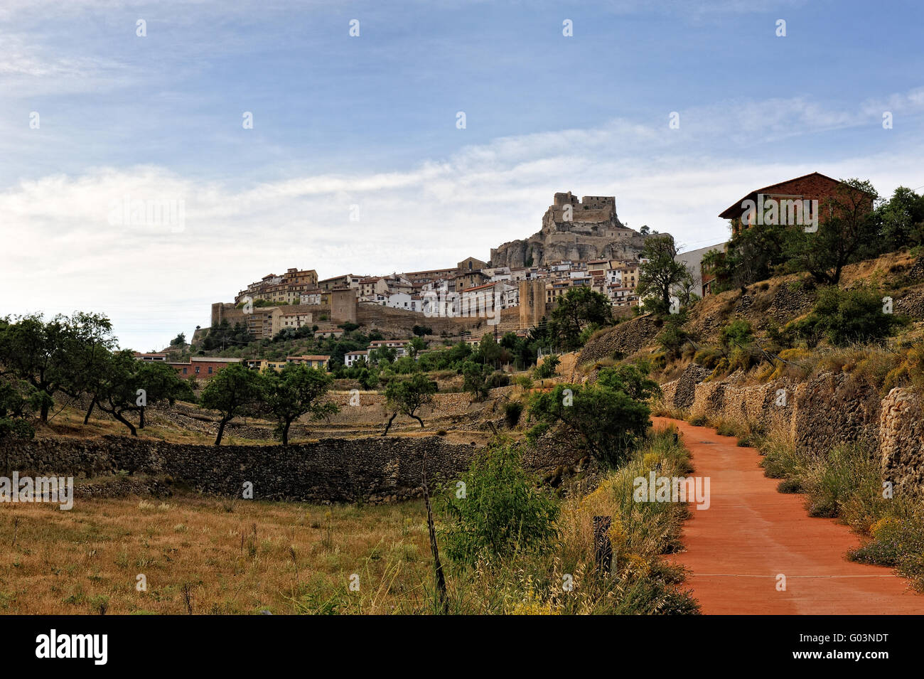 Morella in Spain. Landscape with rural road with castle and town Stock