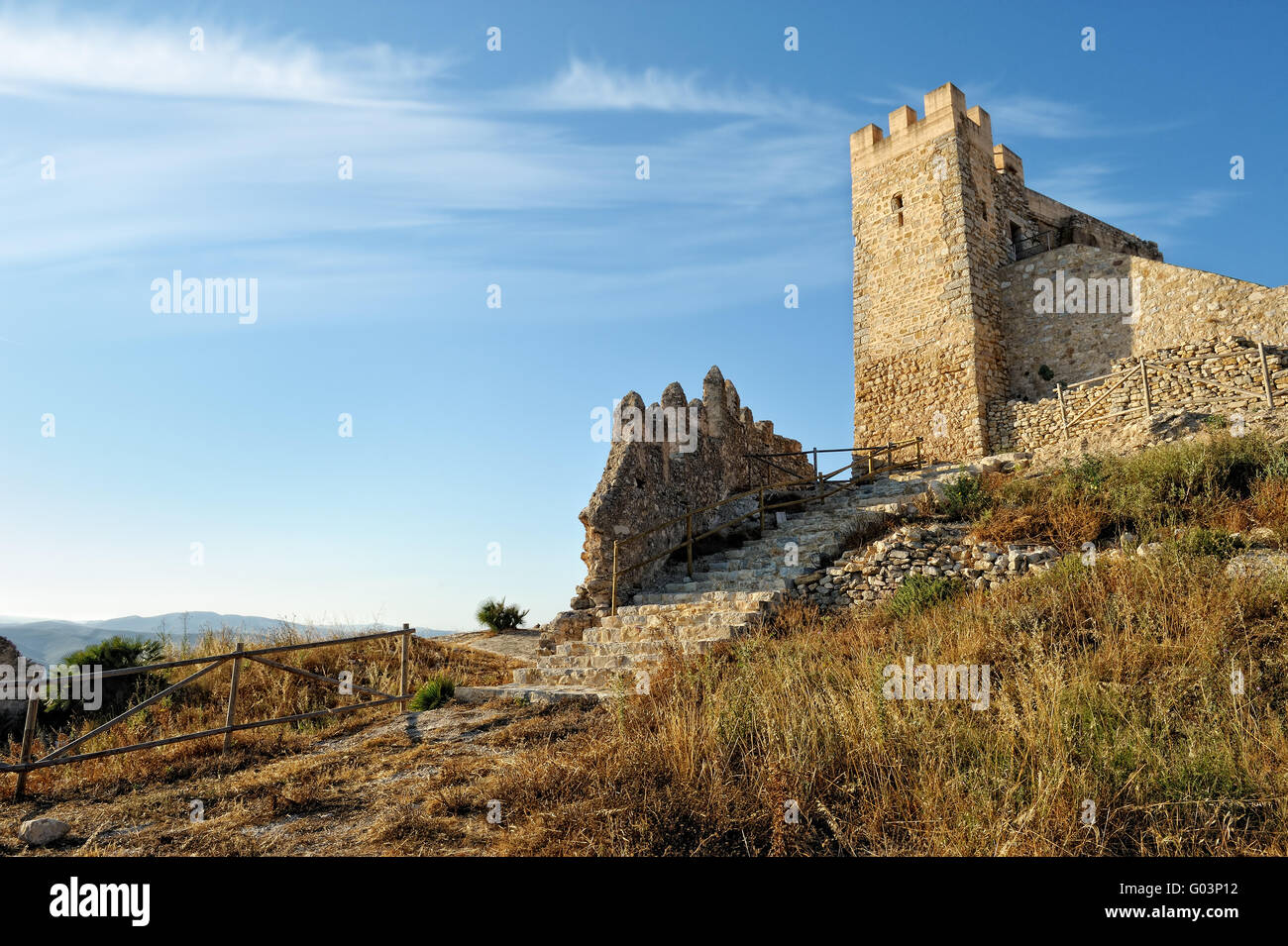 Bottom view to the old castle and mountains. Alcala de Xivert in Spain ...