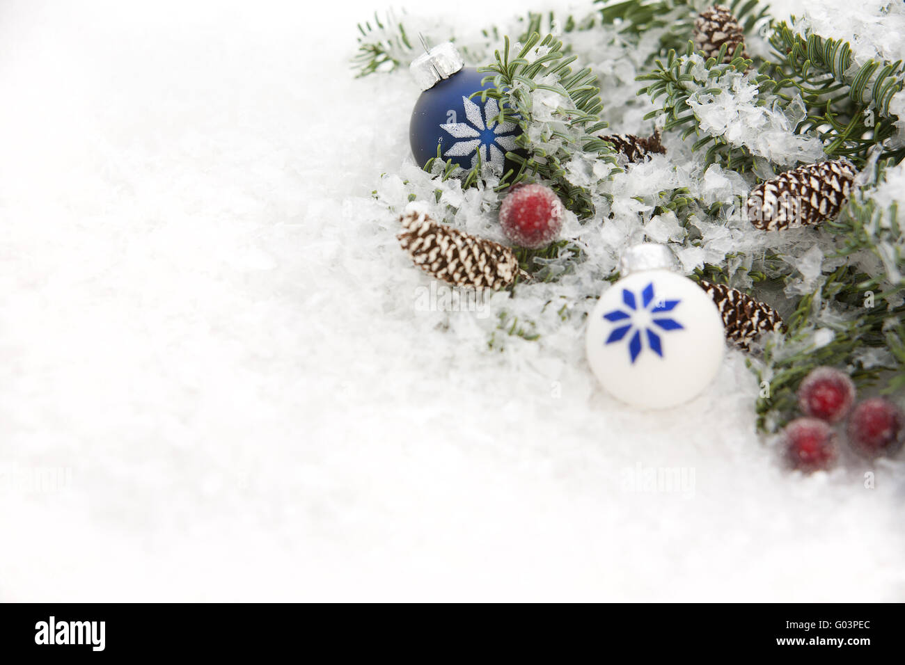 Blue spruce in snow and Christmas decorations Stock Photo