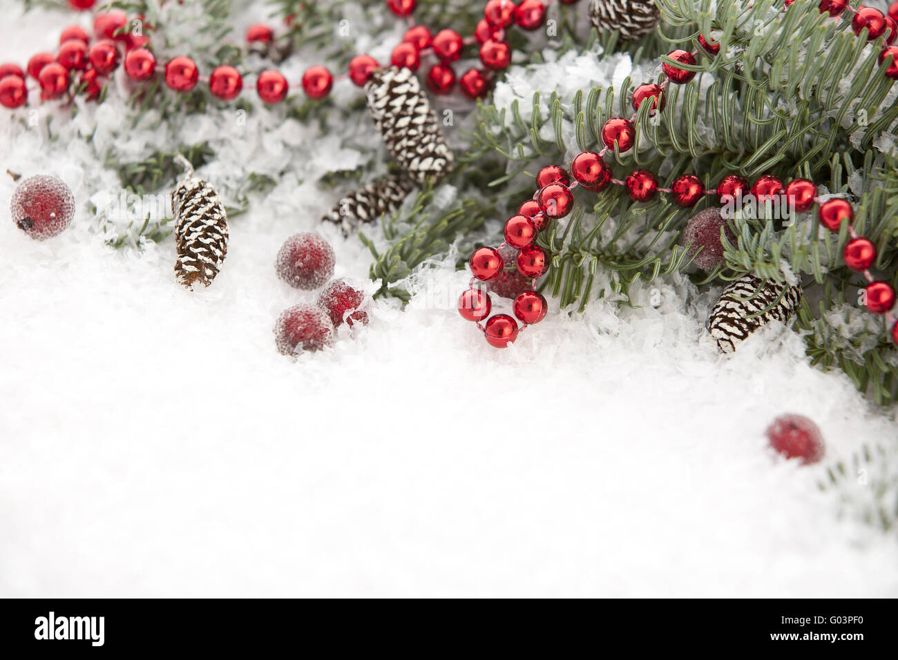 Blue spruce in snow and Christmas decorations Stock Photo