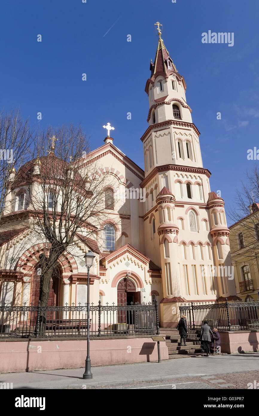 VILNIUS, LITHUANIA - MAY 01, 2013: The believing parishioners come into orthodox church on'Didzioji' street  (Biggest Street) to Stock Photo