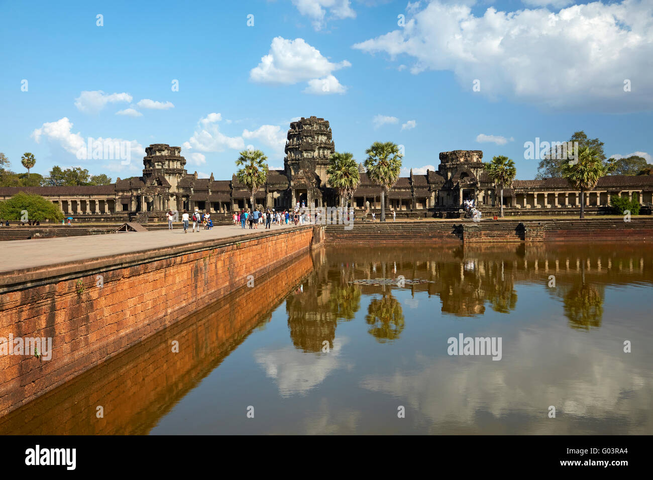 Ancient sandstone causeway crossing the moat to Angkor Wat (12th