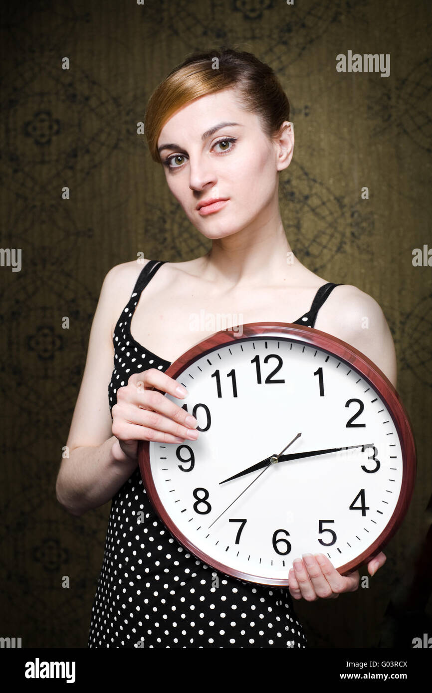 Woman with clock Stock Photo