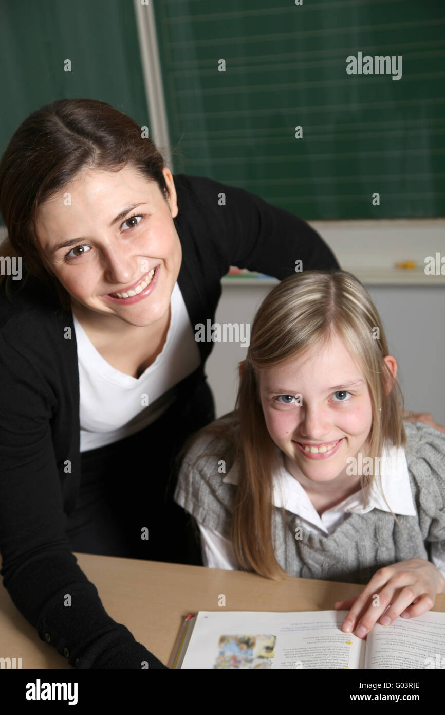 Cheerful teacher and student in the classroom wi Stock Photo