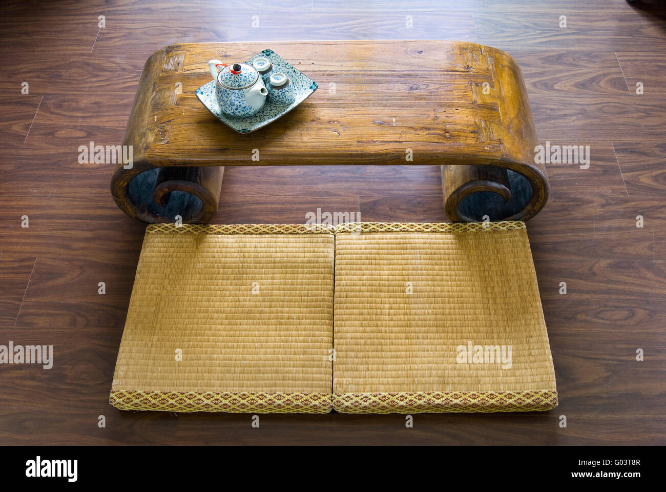 Traditional Japanese straw mattress, table and tea pot. Stock Photo