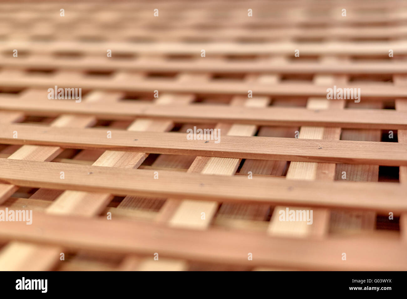Close Up Wood lattice for growing vines and other plants in a garden with shallow depth of field Stock Photo