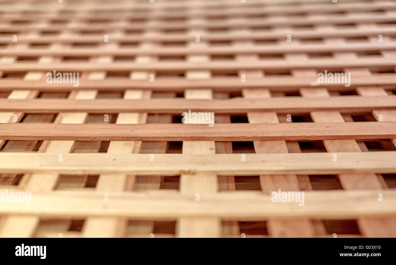Close Up Wood lattice for growing vines and other plants in a garden with shallow depth of field Stock Photo