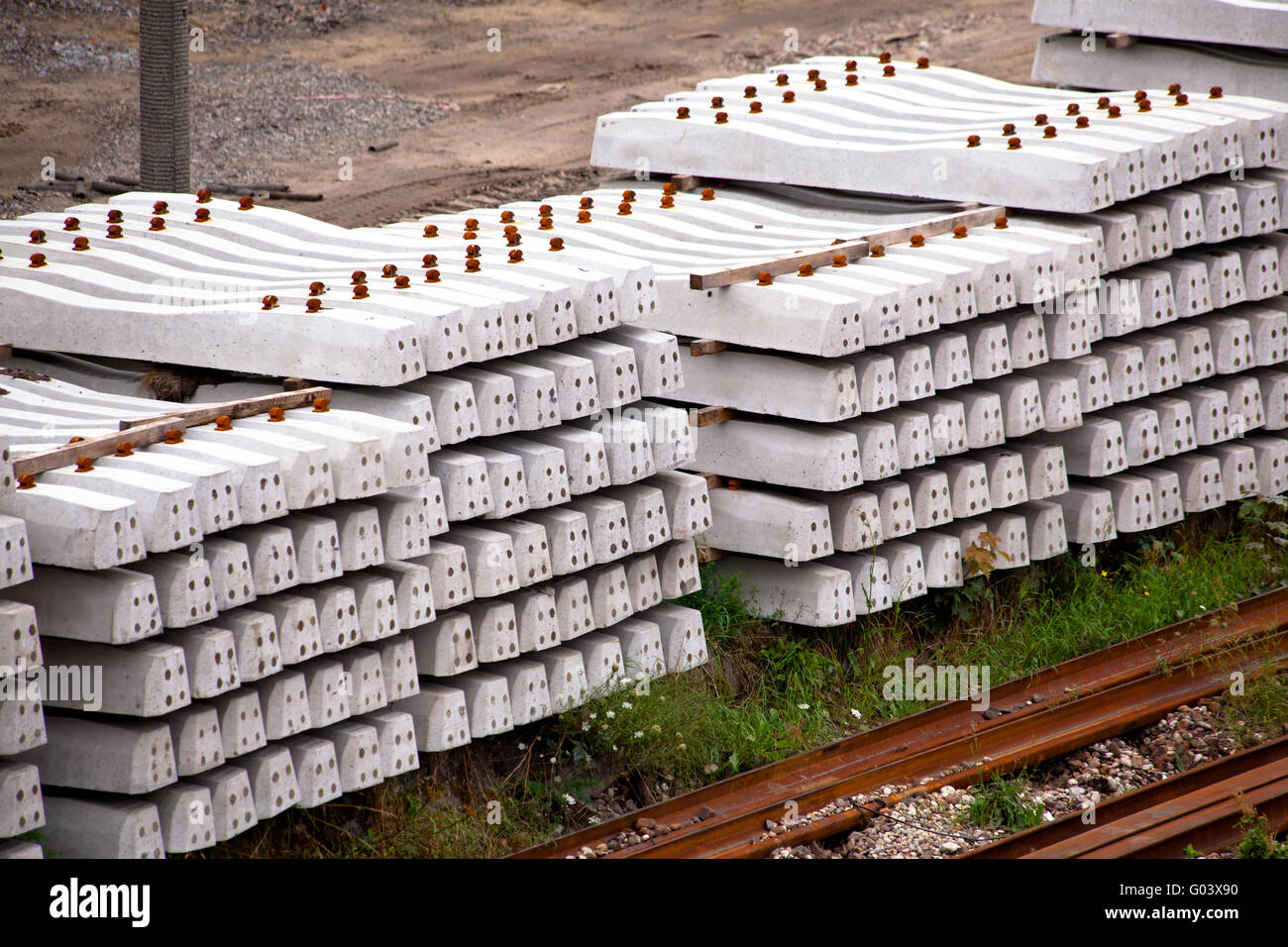 Stack of concrete railway sleepers on the ground Stock Photo - Alamy