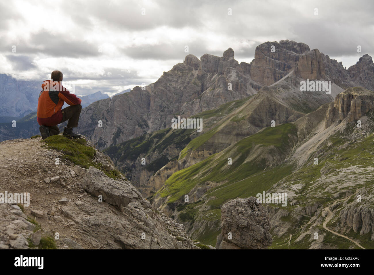 A hiker can look down into the valley. Stock Photo