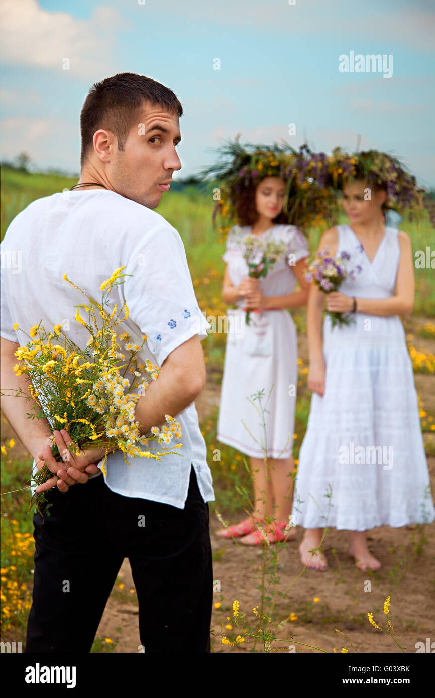 difficult choices. man and two womans. outdoor shot Stock Photo