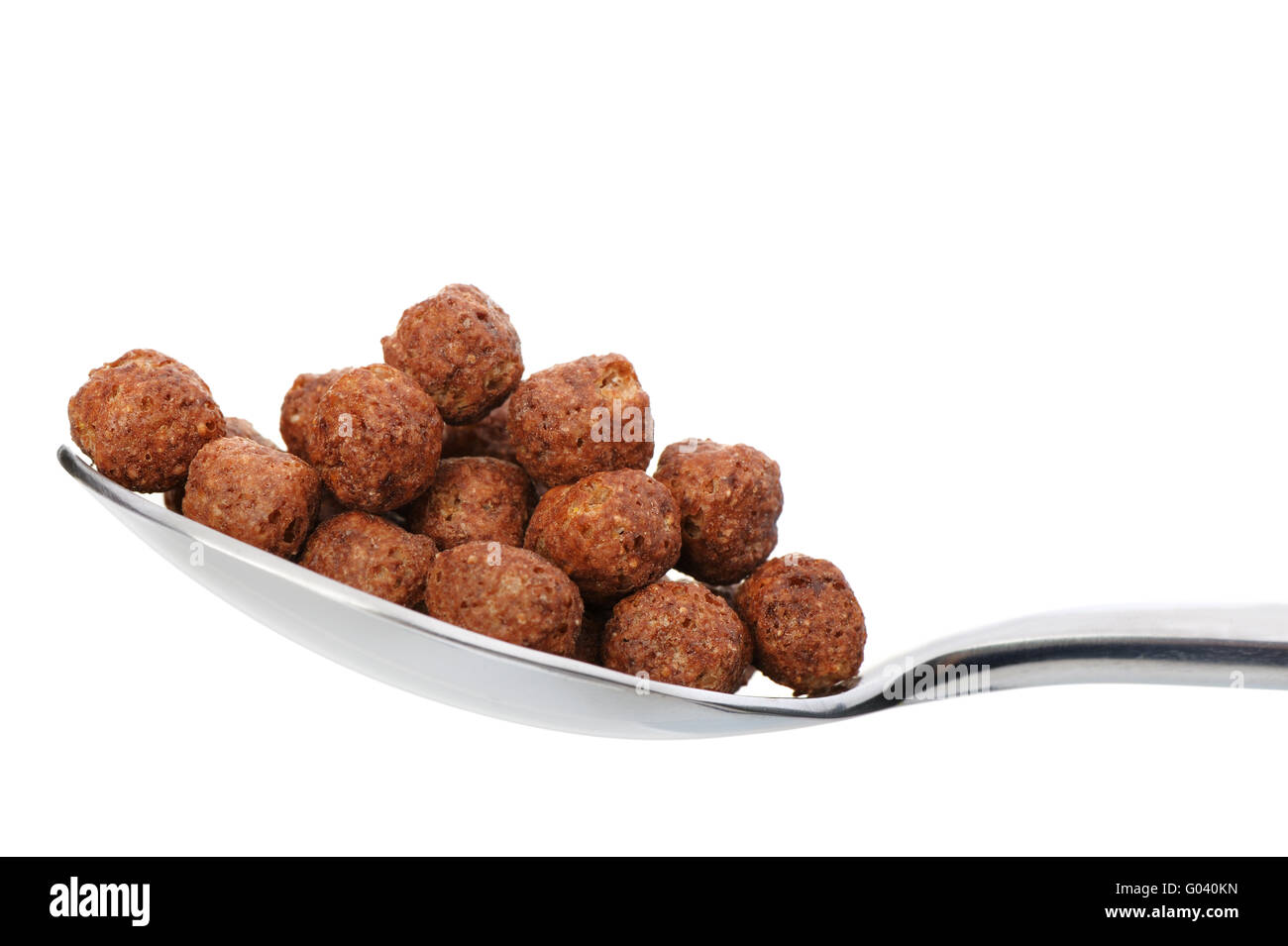 Chocolate cornflakes. A dry breakfast in a spoon. Stock Photo