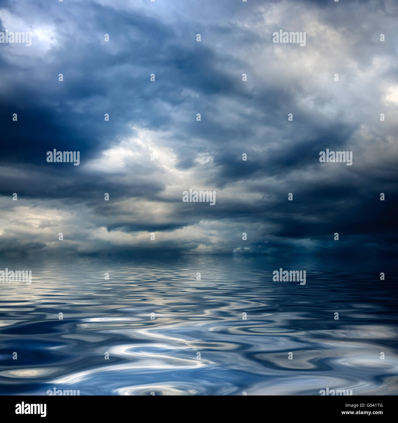 dark cloudy stormy sky with clouds and waves in the sea Stock Photo - Alamy