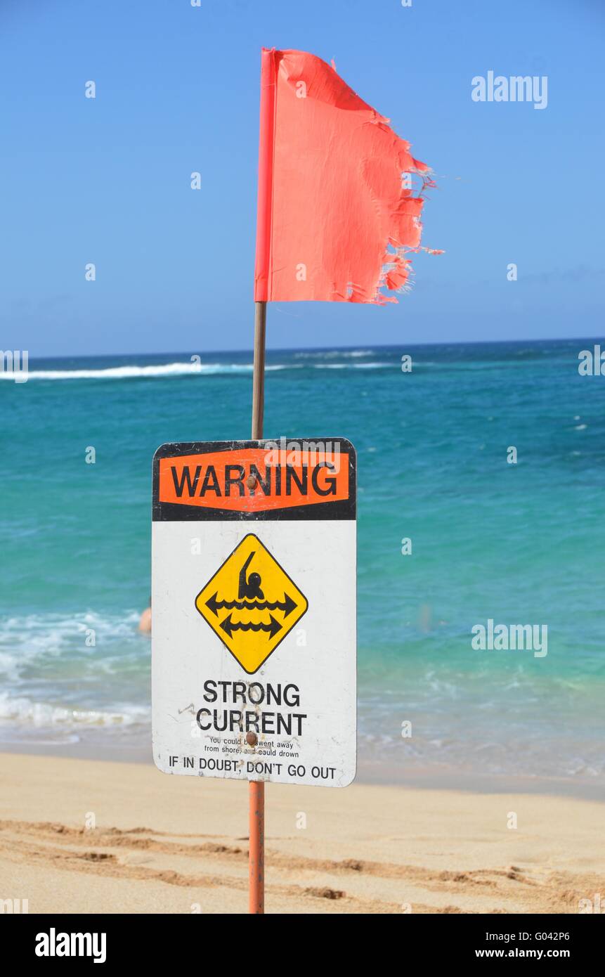 Strong current warning sign and flag Stock Photo